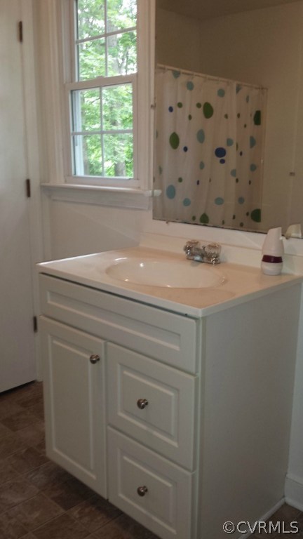 3564 Athey Road Sandy Hook, VA 23153 - Photo 9 of 12 a bathroom with a sink and a mirror