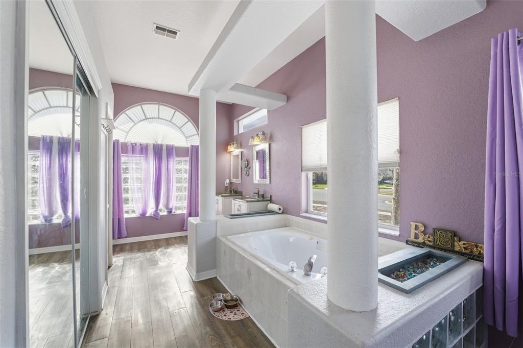 13403 Bolton Court Spring Hill, FL 34609 - Photo 13 of 36 a large spacious bathroom with a large tub and shower