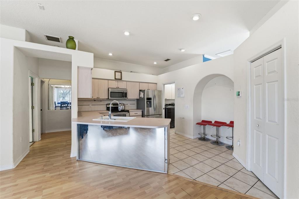 13403 Bolton Court Spring Hill, FL 34609 - Photo 18 of 36 a view of kitchen with stainless steel appliances granite countertop a sink and refrigerator