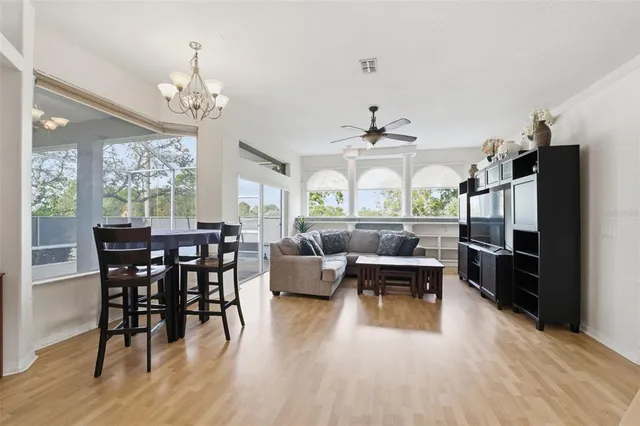 a view of a dining room with furniture window and wooden floor