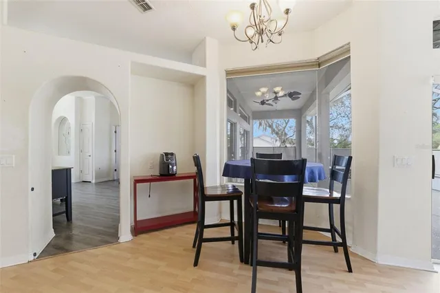 a view of a dining room with furniture and window