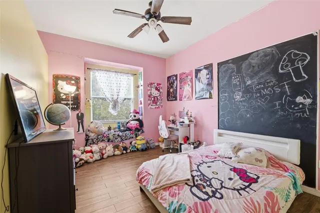 a bedroom with bed and a window