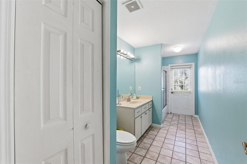 13403 Bolton Court Spring Hill, FL 34609 - Photo 29 of 36 a bathroom with a sink a toilet and shower