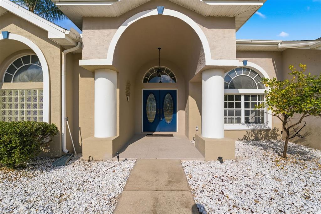 13403 Bolton Court Spring Hill, FL 34609 - Photo 7 of 36 a front view of a house with garden
