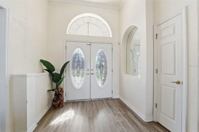 a view of entryway with wooden floor