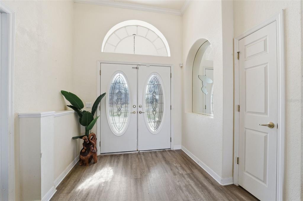 13403 Bolton Court Spring Hill, FL 34609 - Photo 8 of 36 a view of entryway with wooden floor