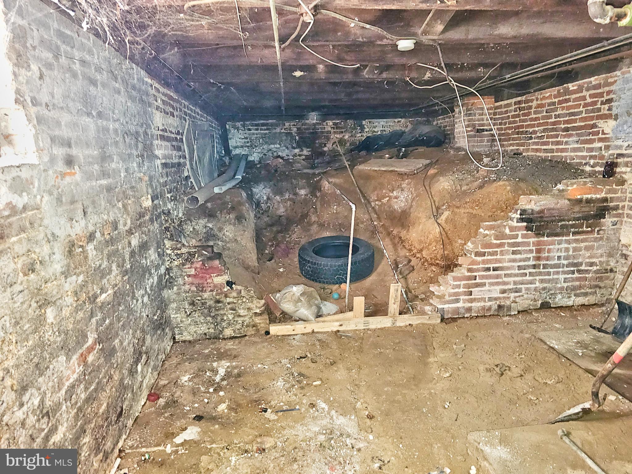 100 Pontiac Avenue Baltimore, MD 21225 - Photo 10 of 13 Unfinished basement with exposed earth.