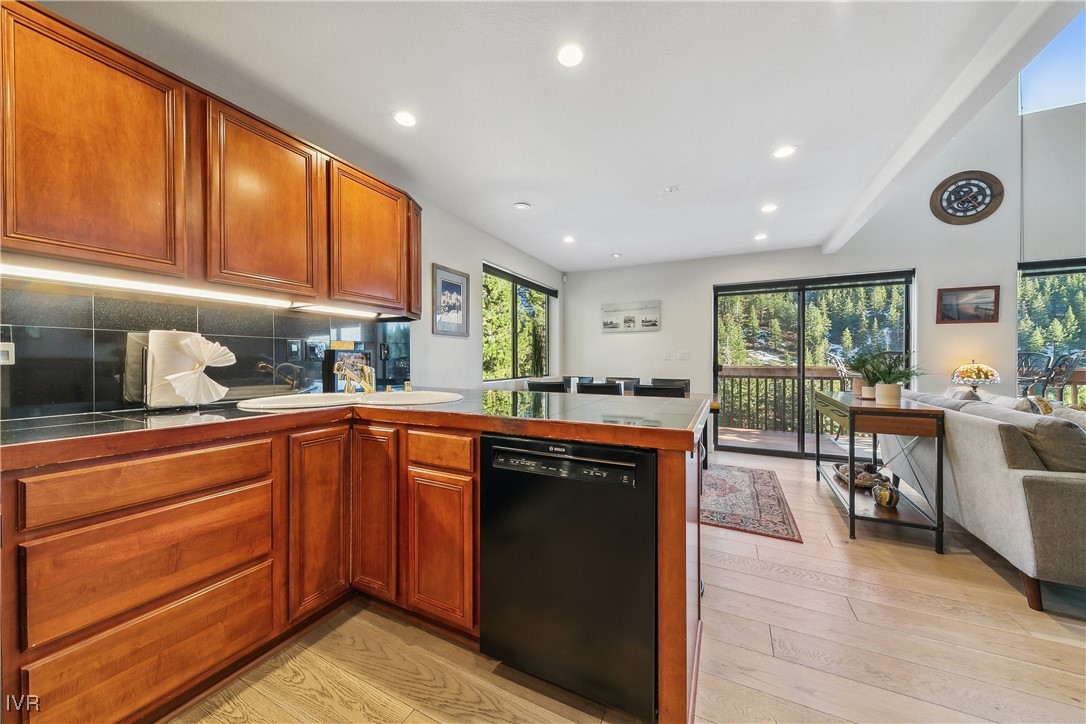 400 Fairview Boulevard, Unit 174 Incline Village, NV 89451 - Photo 11 of 30 a kitchen with stainless steel appliances granite countertop wooden cabinets a sink and a stove