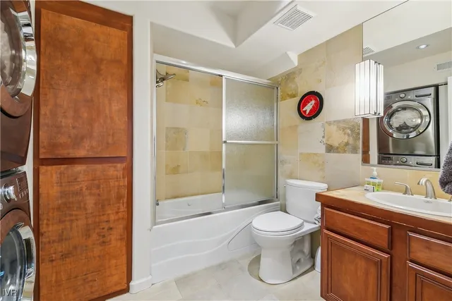 a bathroom with a toilet a sink and a shower