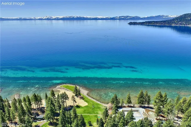 a view of a lake with a yard