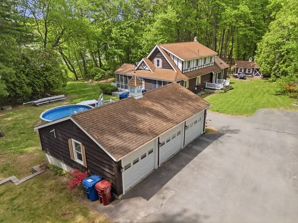 a aerial view of a house with a yard