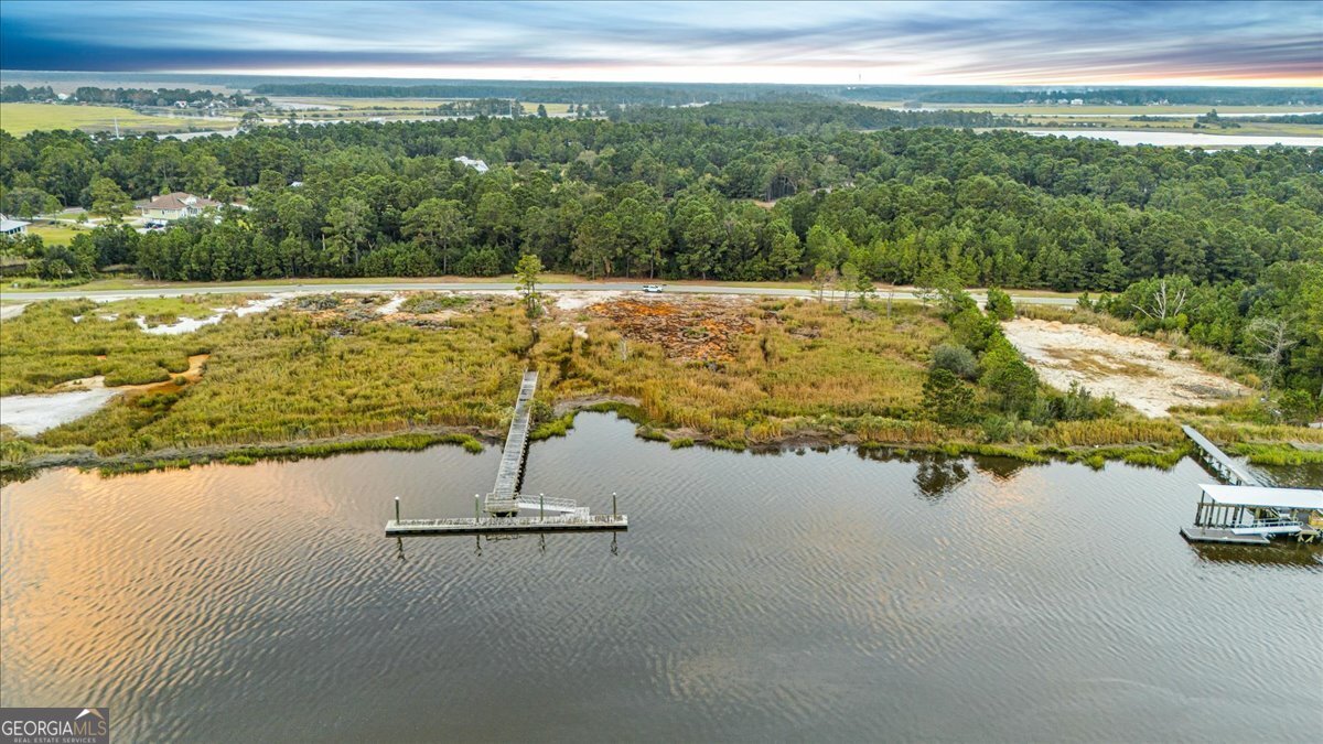 Lot 26 Jerico Marsh Road Midway, GA 31320 - Photo 15 of 24 a view of a swimming pool with an outdoor space and seating area