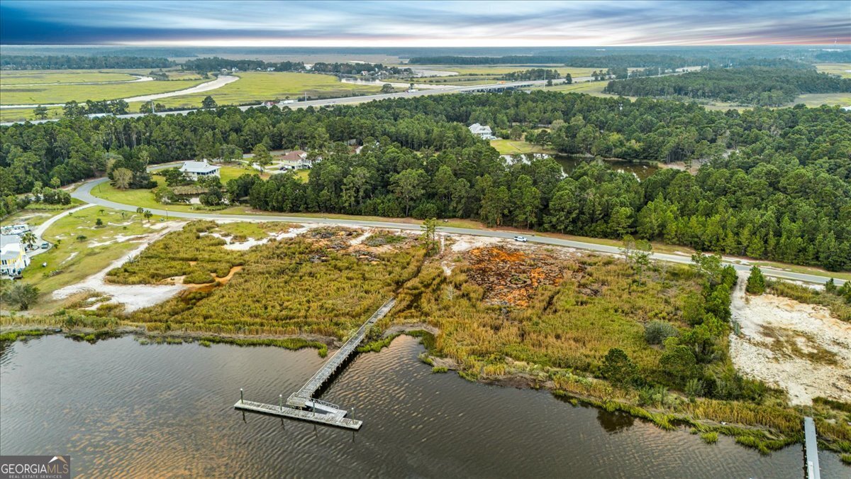 Lot 26 Jerico Marsh Road Midway, GA 31320 - Photo 18 of 24 a view of a swimming pool with a yard