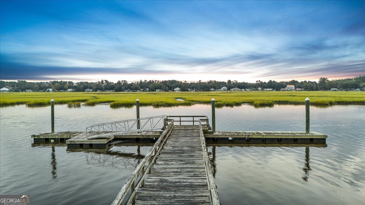 Lot 26 Jerico Marsh Road Midway, GA 31320 - Photo 5 of 24 a view of a lake with houses in the back