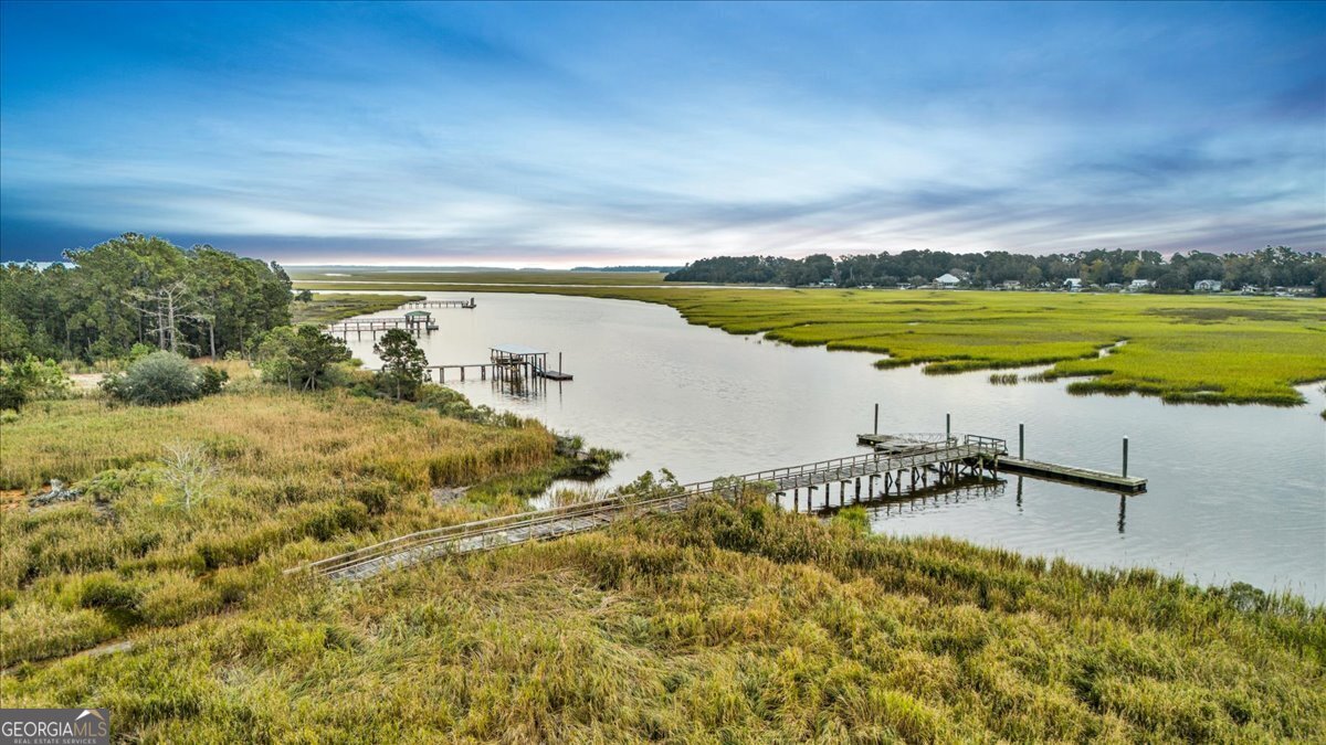Lot 26 Jerico Marsh Road Midway, GA 31320 - Photo 6 of 24 a view of a lake with a big yard