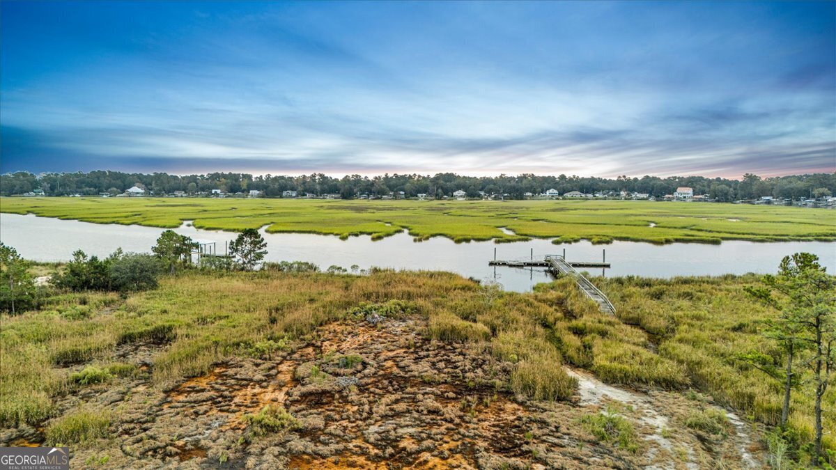 Lot 26 Jerico Marsh Road Midway, GA 31320 - Photo 9 of 24 a view of a lake with a big yard