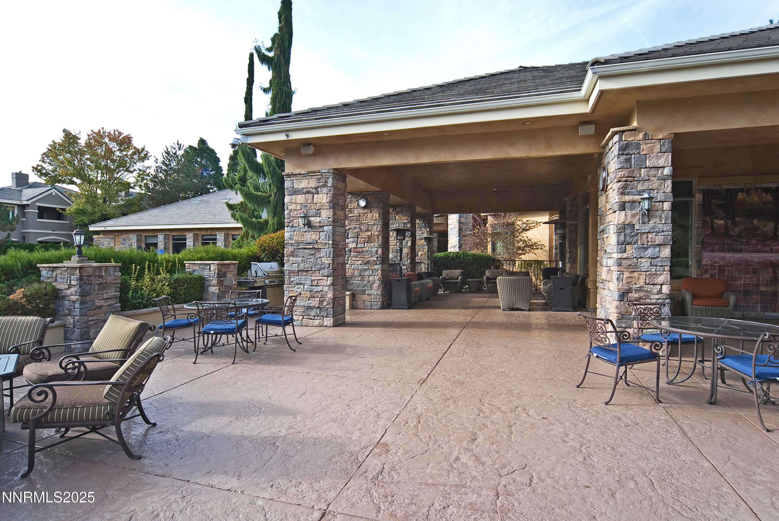 900 South Meadows Parkway, Unit 3522 Reno, NV 89521 - Photo 11 of 24 a view of patio with table and chairs under an umbrella