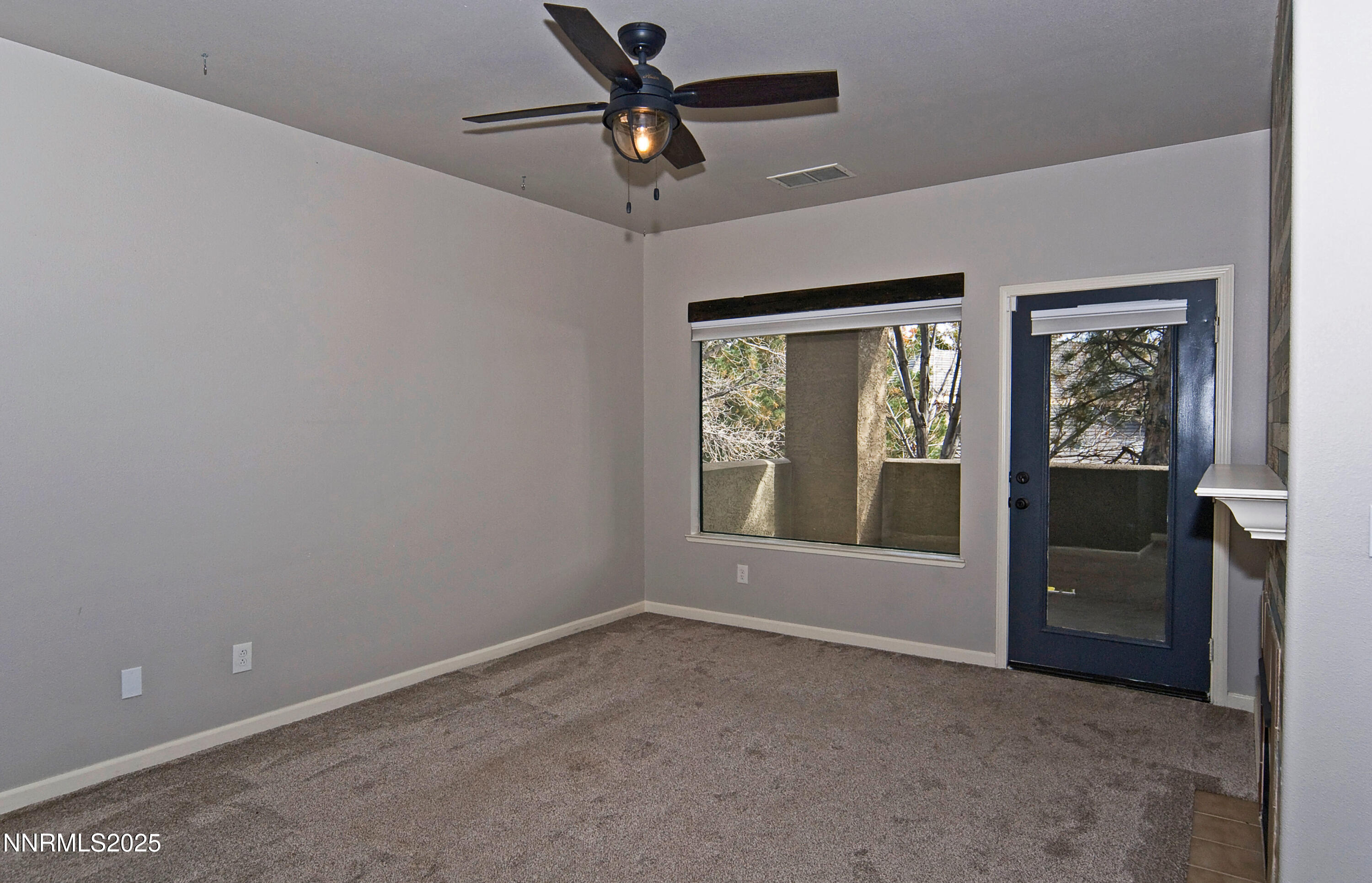 900 South Meadows Parkway, Unit 3522 Reno, NV 89521 - Photo 5 of 24 an empty room with windows and fan