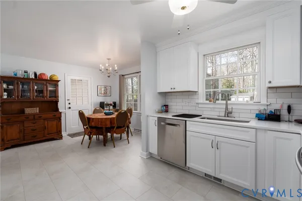 a kitchen with sink cabinets and window