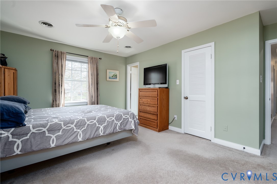 11801 Wiesinger Lane Midlothian, VA 23113 - Photo 20 of 34 a bed room with a bed and a television
