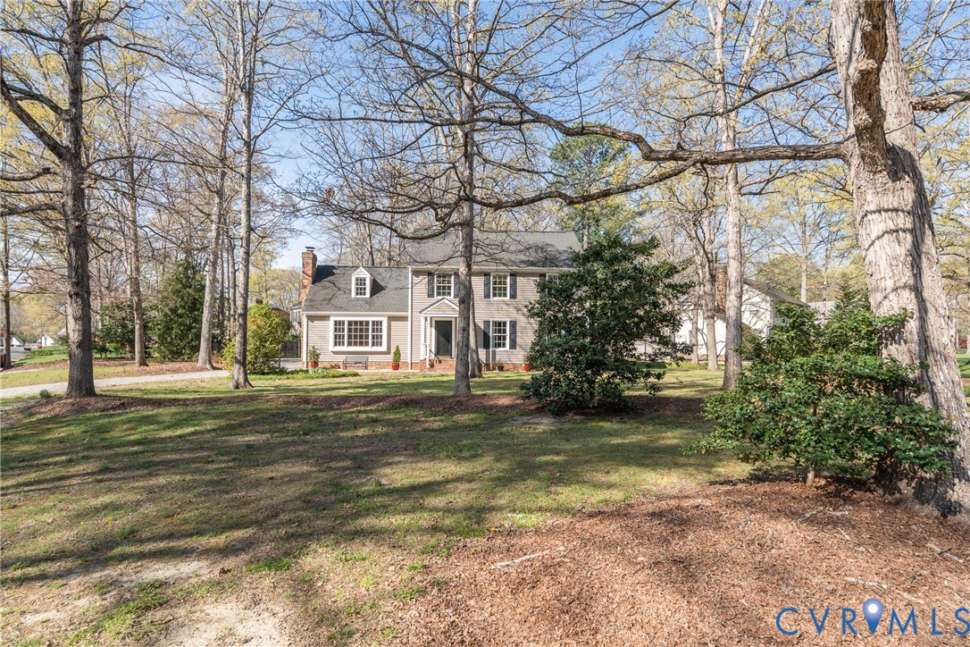 11801 Wiesinger Lane Midlothian, VA 23113 - Photo 2 of 34 a front view of a house with a garden