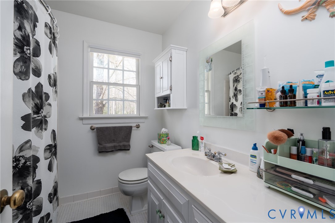 11801 Wiesinger Lane Midlothian, VA 23113 - Photo 24 of 34 a bathroom with a sink a toilet and a window