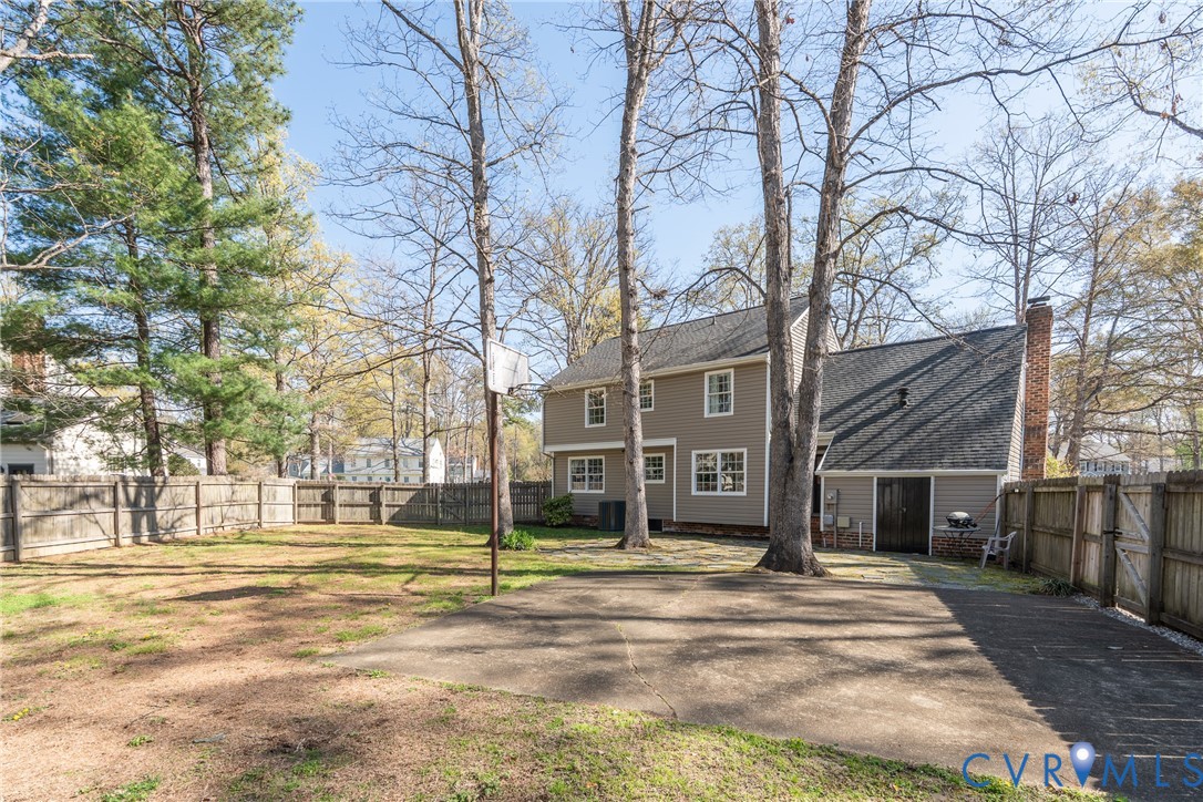 11801 Wiesinger Lane Midlothian, VA 23113 - Photo 32 of 34 a view of a white house with a yard and large tree