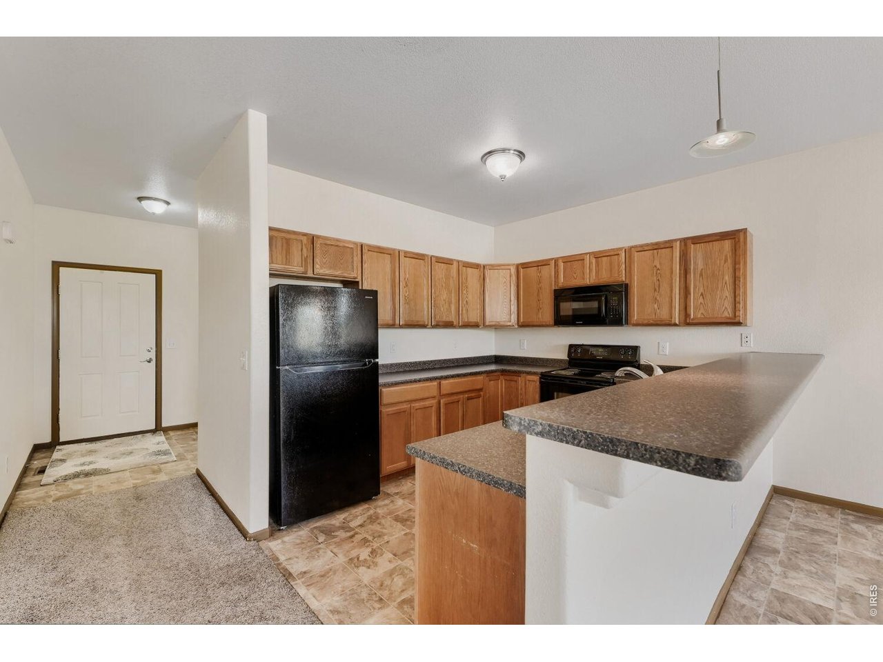 369 Naples Street Firestone, CO 80520 - Photo 17 of 29 Kitchen toward entry
