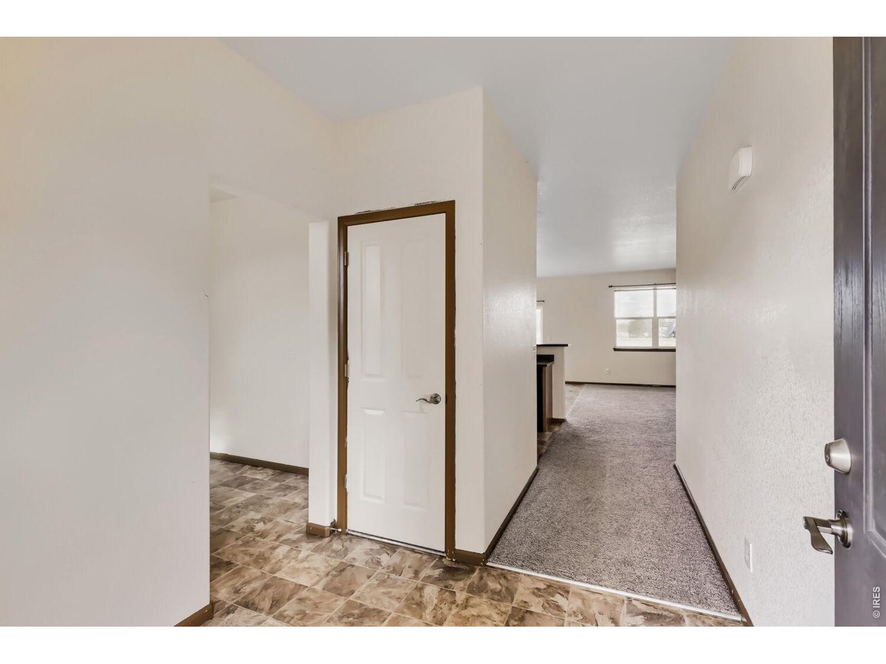 369 Naples Street Firestone, CO 80520 - Photo 18 of 29 Entry into home with Hall Closet, Drop Zone Space & next to Large Laundry room