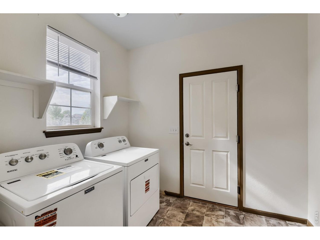369 Naples Street Firestone, CO 80520 - Photo 19 of 29 Large Laundry Room between entry and garage