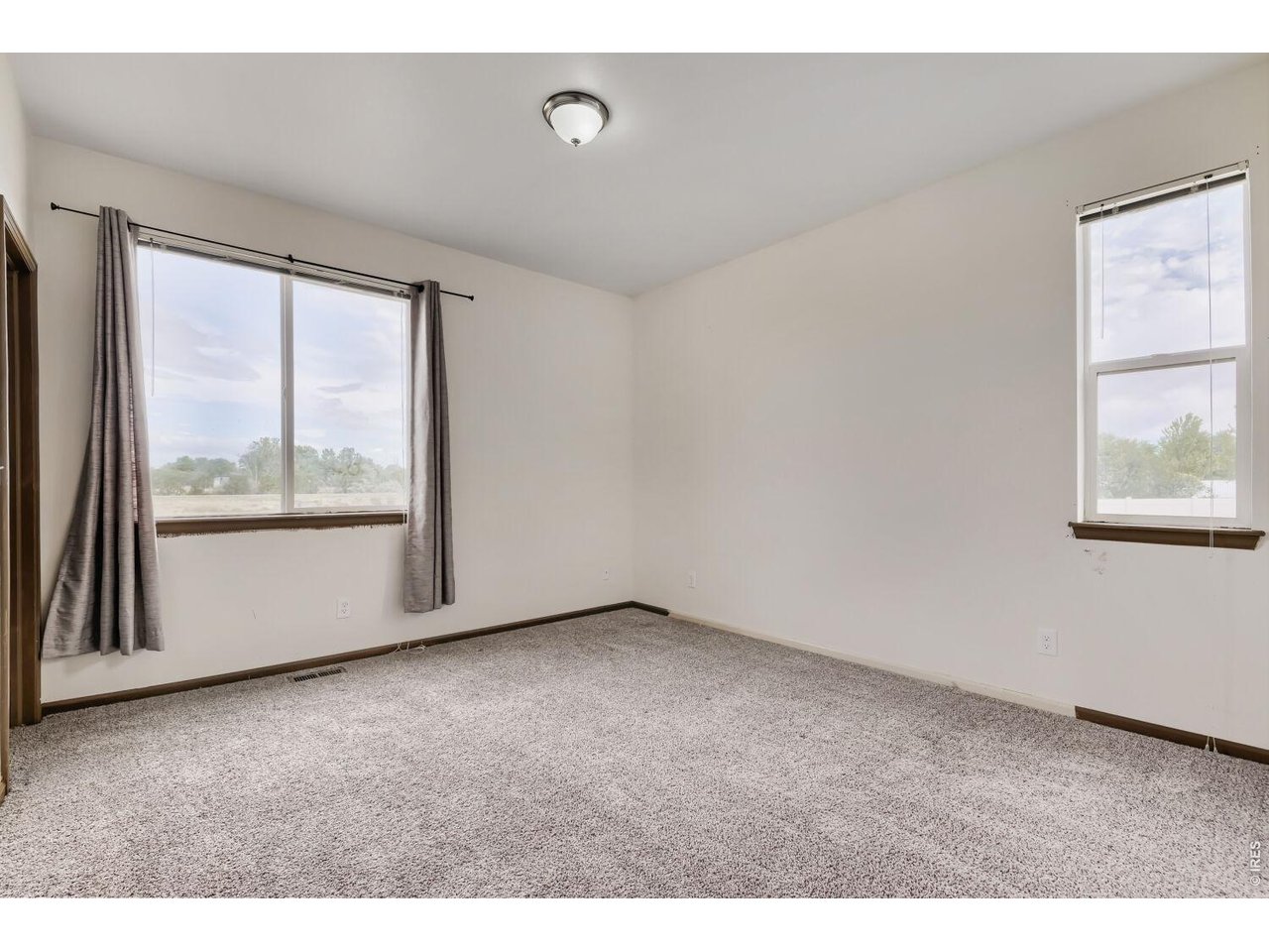 369 Naples Street Firestone, CO 80520 - Photo 5 of 29 Primary Suite with Mountain Views