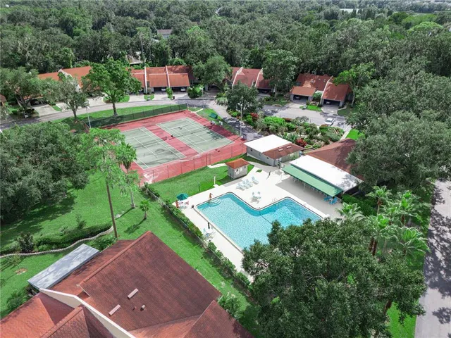 a view of a house with a yard and sitting area