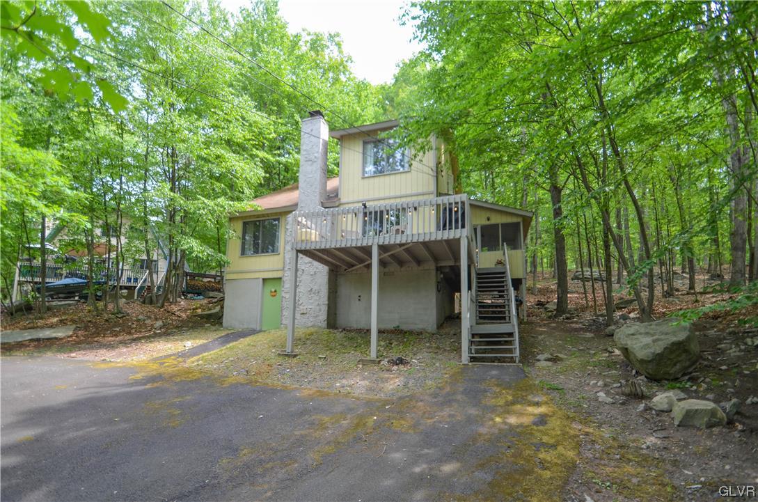 208 Regent Street Bushkill, PA 18324 - Photo 1 of 37 front view of a house with a chairs and table