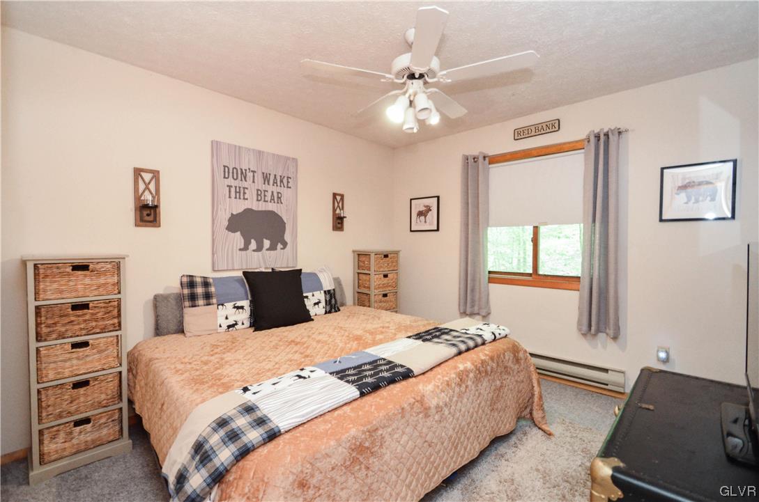 208 Regent Street Bushkill, PA 18324 - Photo 23 of 37 a bedroom with a large bed and a window