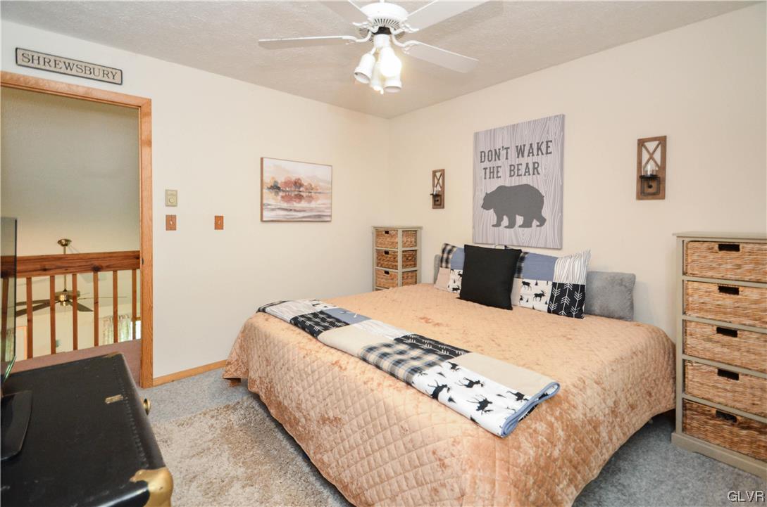 208 Regent Street Bushkill, PA 18324 - Photo 24 of 37 a bedroom with a bed and a dresser