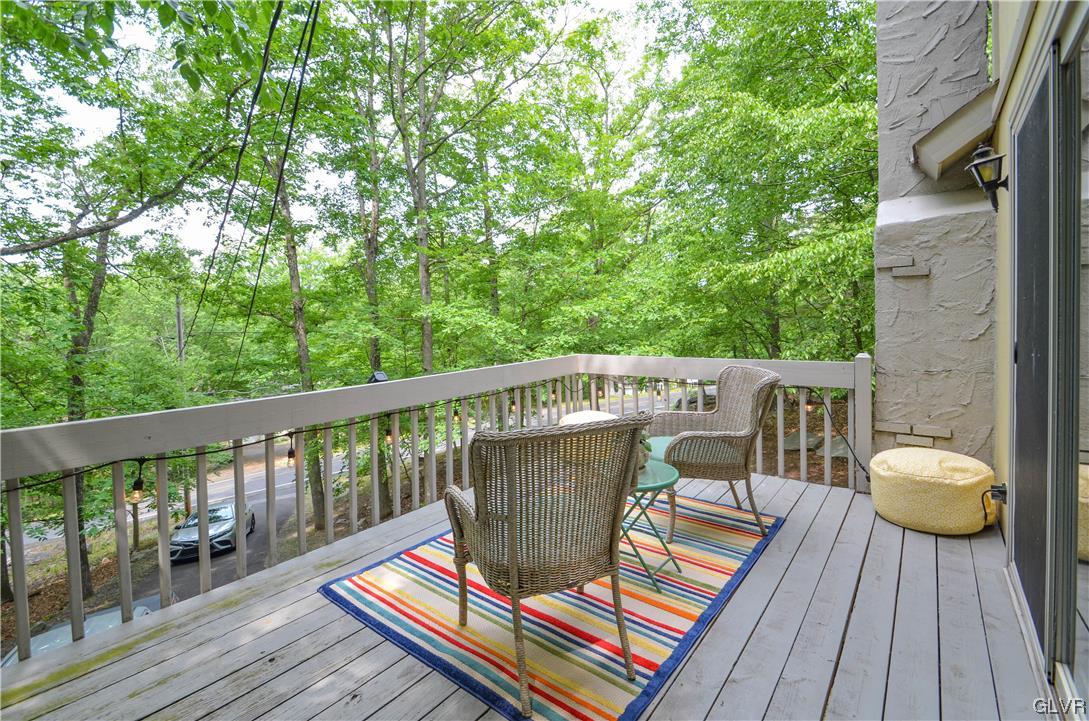 208 Regent Street Bushkill, PA 18324 - Photo 32 of 37 a balcony with wooden floor table and chairs