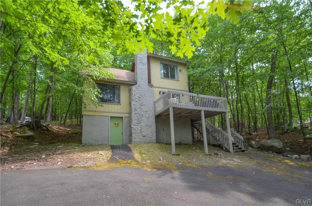 208 Regent Street Bushkill, PA 18324 - Photo 35 of 37 a view of a house with backyard and trees