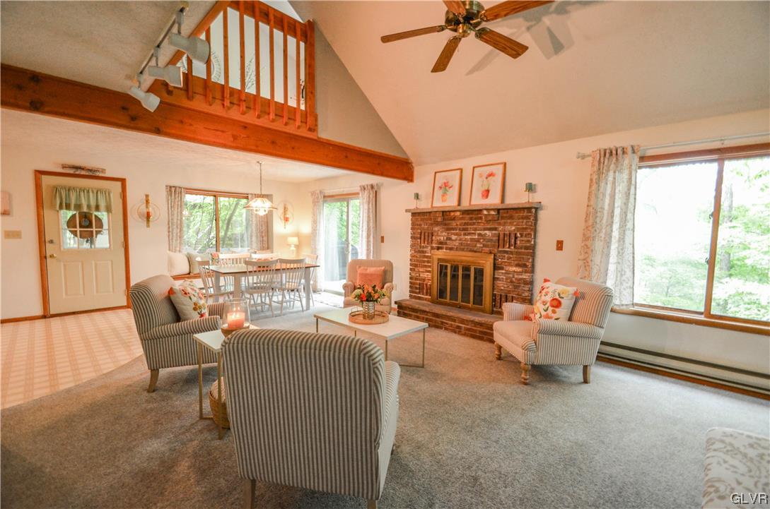 208 Regent Street Bushkill, PA 18324 - Photo 5 of 37 a living room with fireplace furniture and a large window