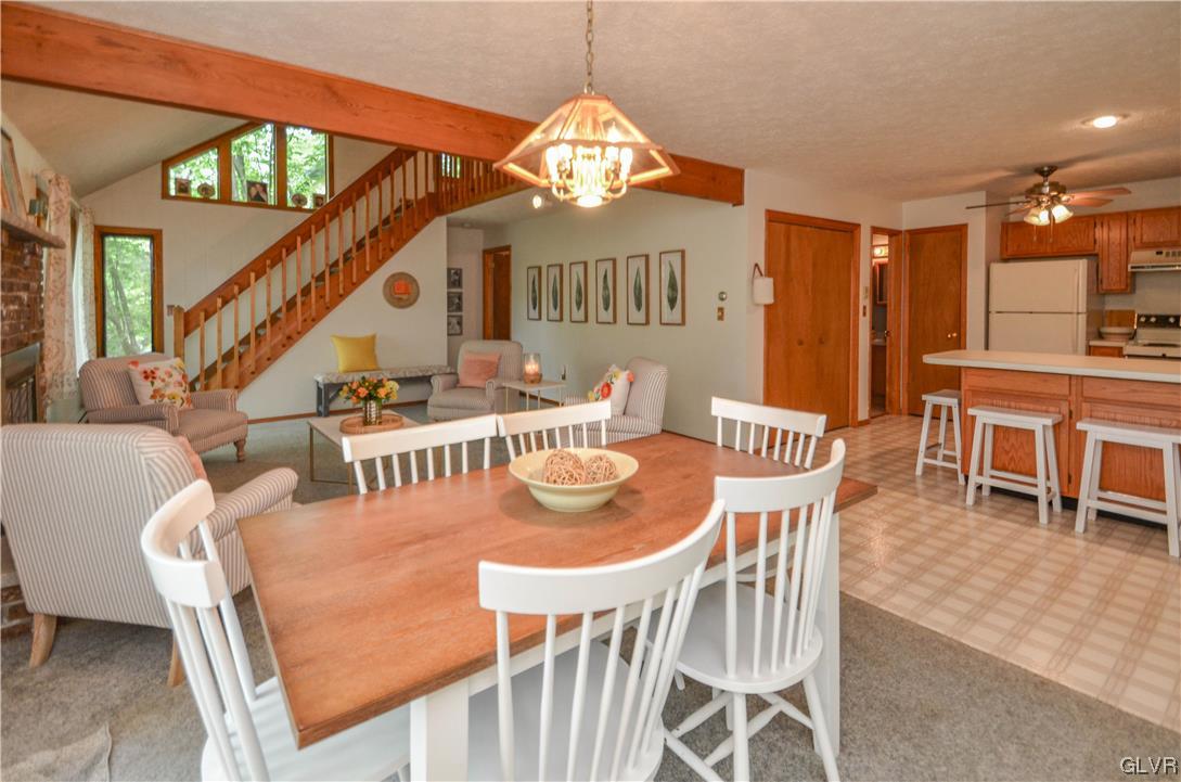 208 Regent Street Bushkill, PA 18324 - Photo 10 of 37 a view of a dining room with furniture and a chandelier