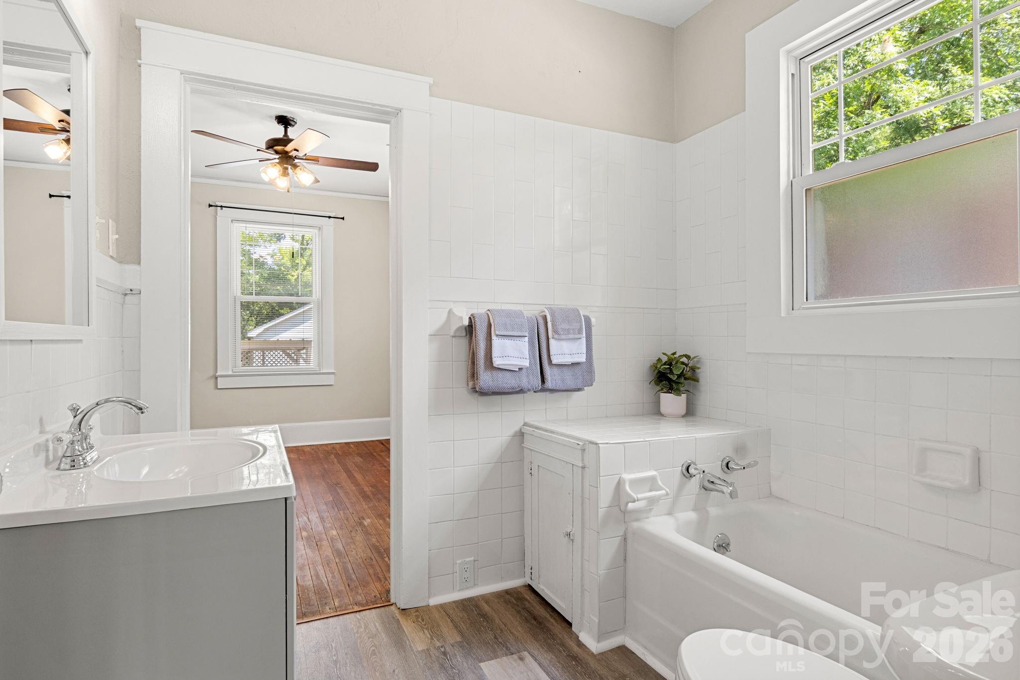 108 Reedy Street Chester, SC 29706 - Photo 24 of 42 a bathroom with a tub sink toilet and window