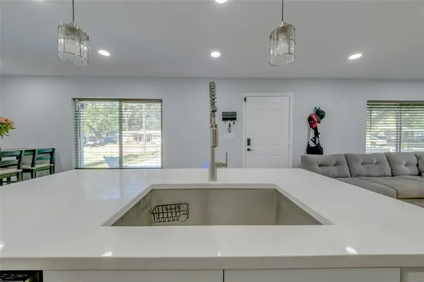 a view of a room that has a couch and a window in it