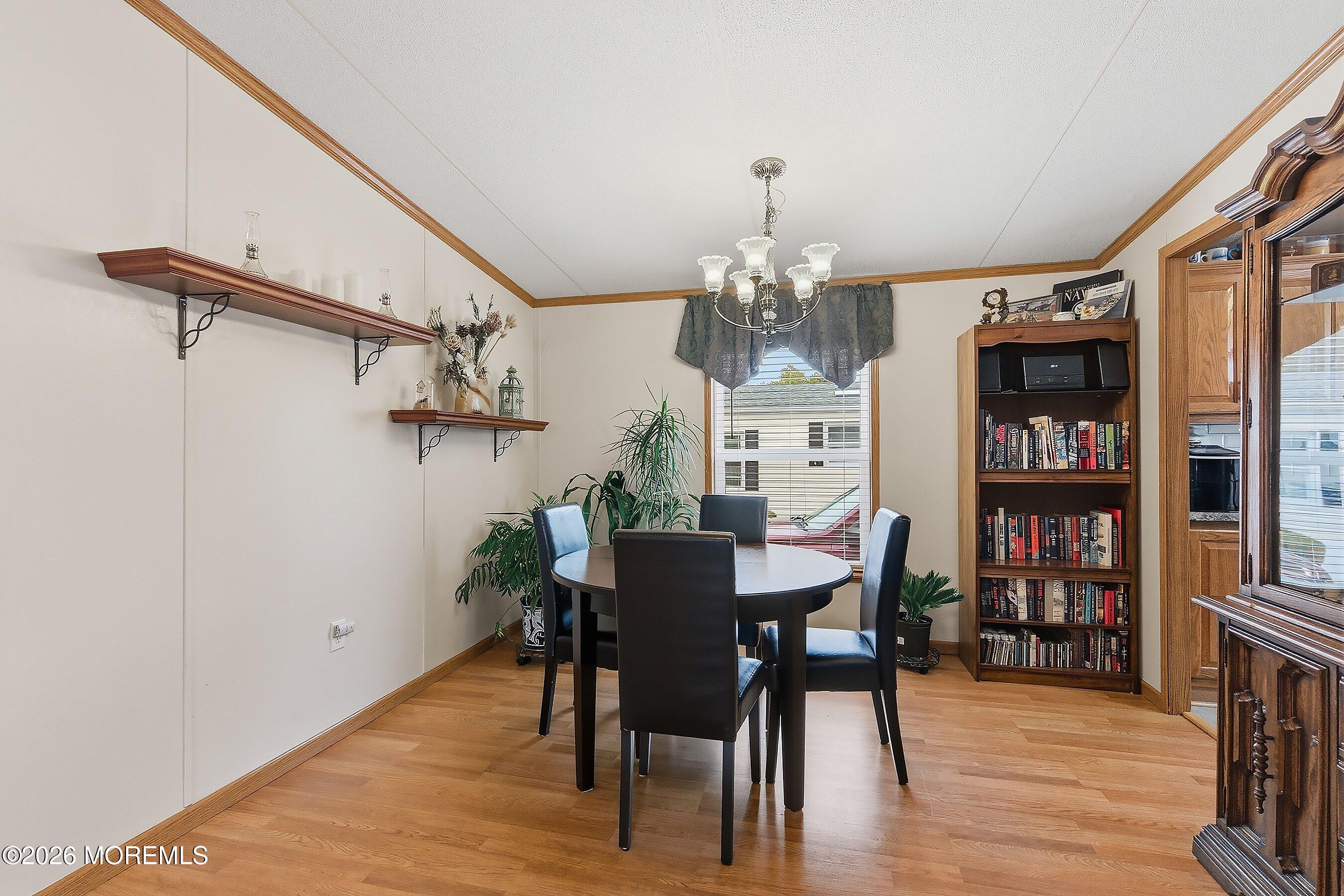 536 Momosa Way Whiting, NJ 08759 - Photo 11 of 54 a view of a dining room with furniture and wooden floor