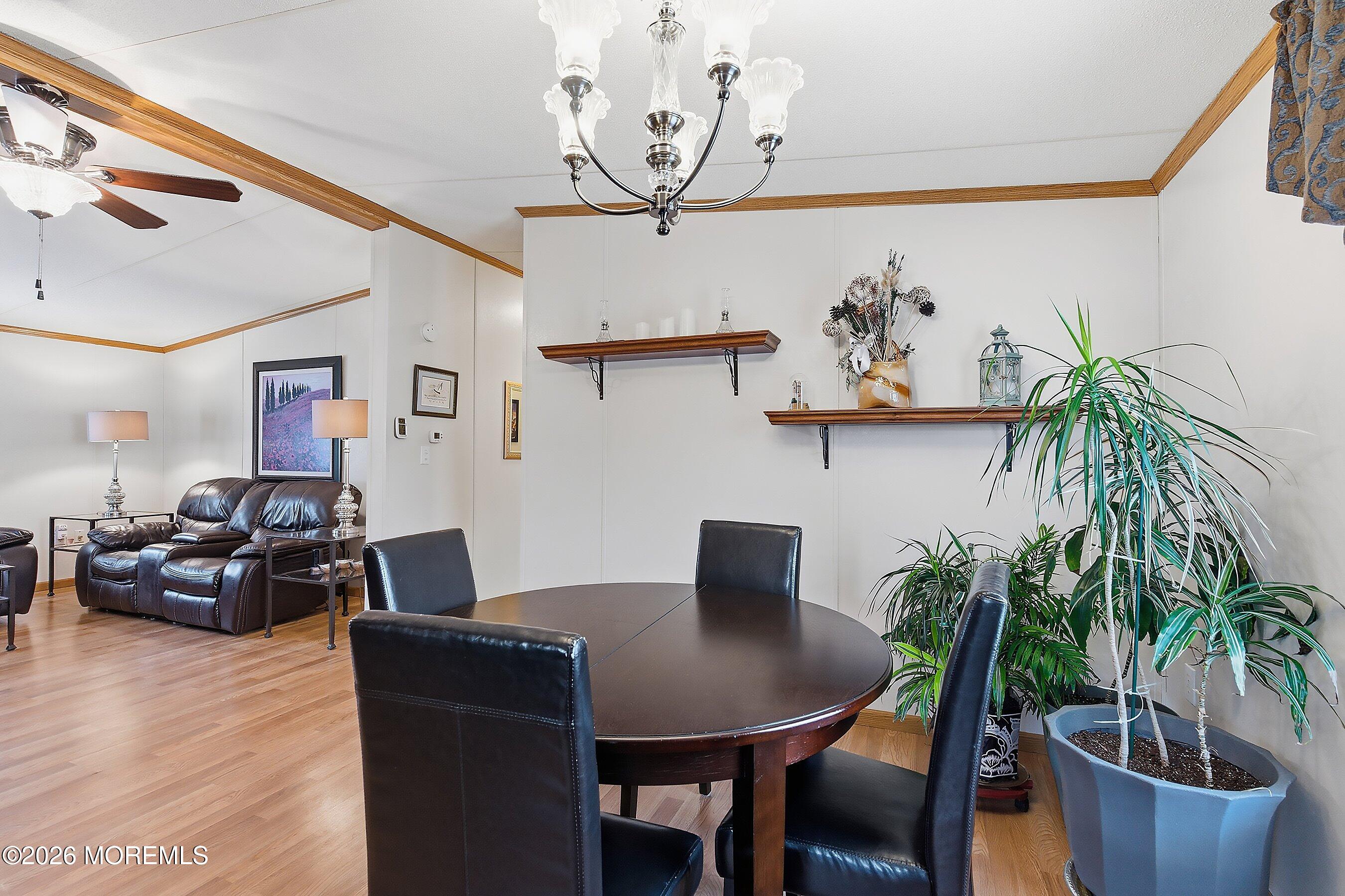 536 Momosa Way Whiting, NJ 08759 - Photo 12 of 54 a view of a dining room with furniture and wooden floor