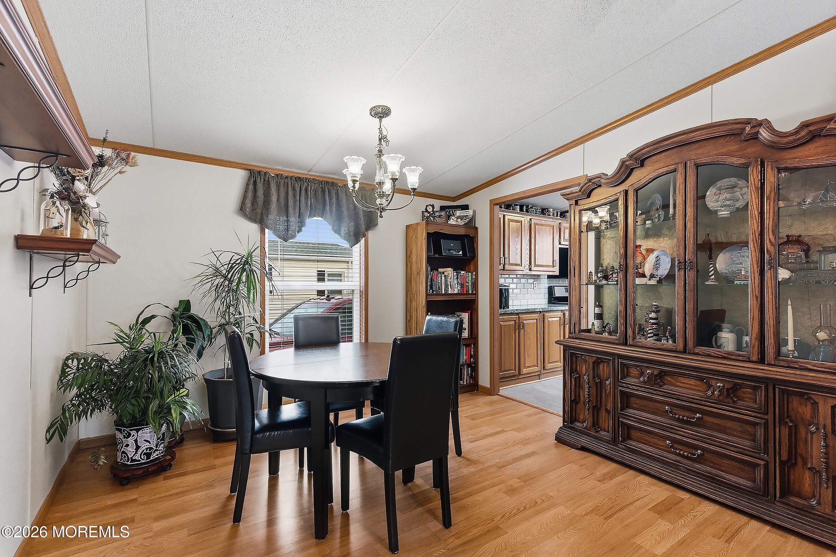 536 Momosa Way Whiting, NJ 08759 - Photo 13 of 54 a view of a dining room with furniture and chandelier