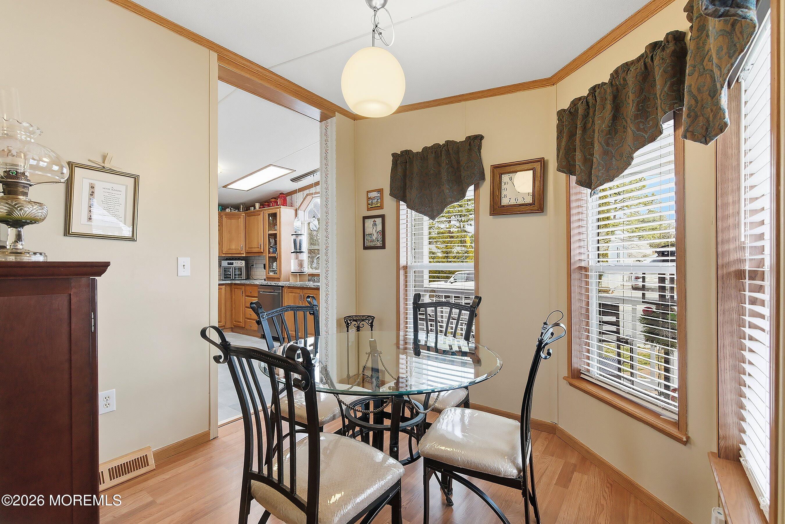 536 Momosa Way Whiting, NJ 08759 - Photo 14 of 54 a view of a dining room with furniture window and wooden floor