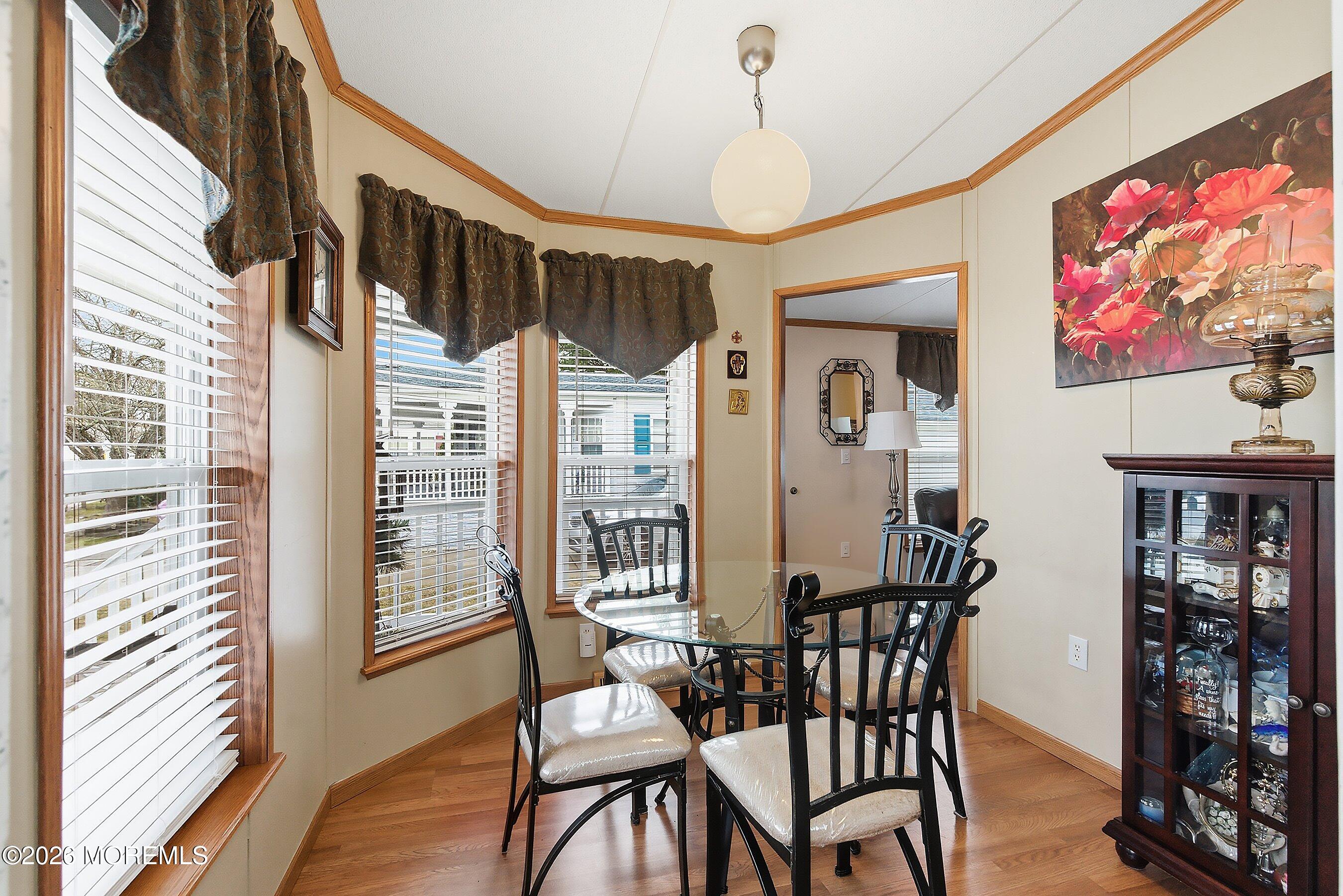536 Momosa Way Whiting, NJ 08759 - Photo 15 of 54 a view of a dining room with furniture window and wooden floor