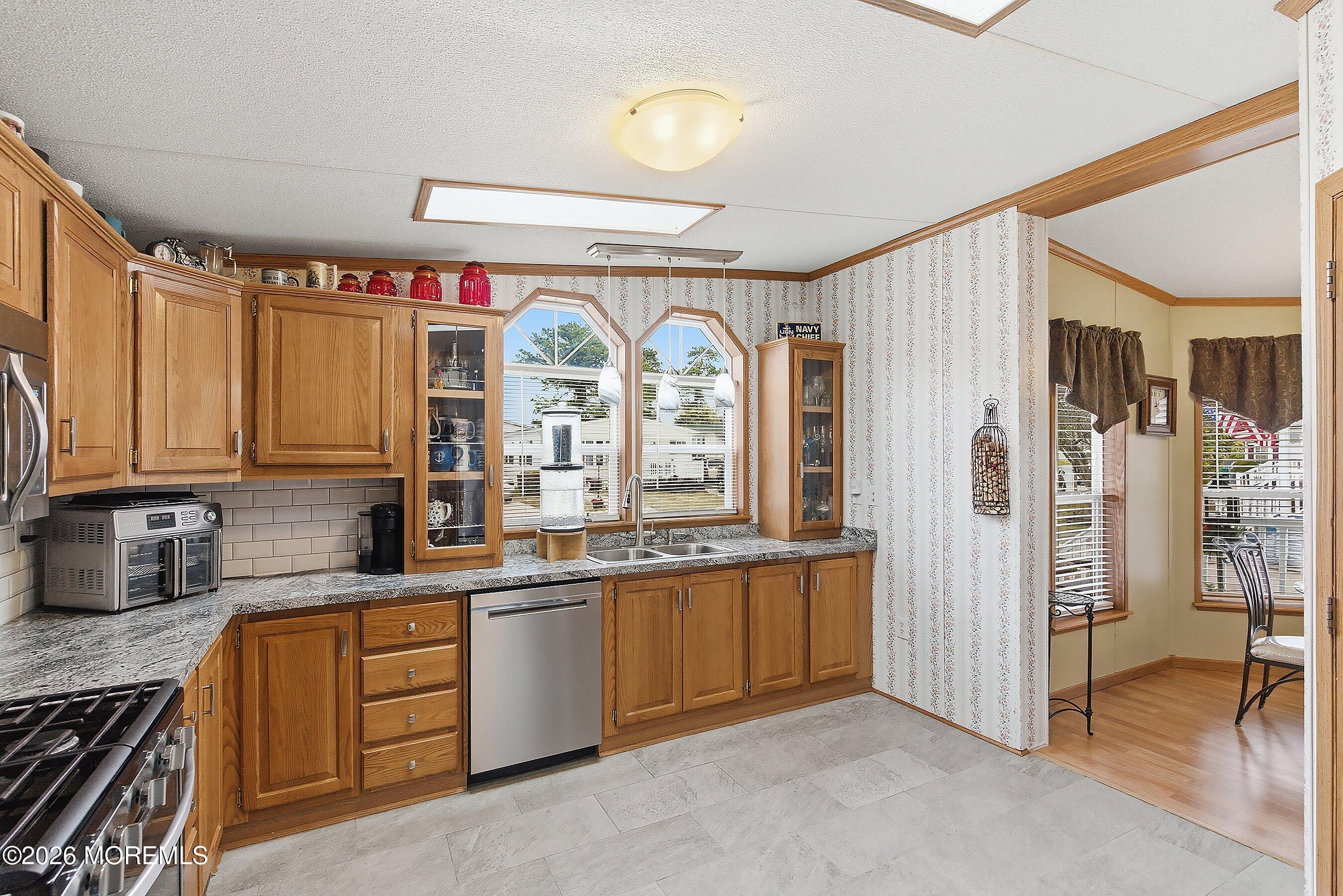 536 Momosa Way Whiting, NJ 08759 - Photo 19 of 54 a kitchen with granite countertop a sink stainless steel appliances and cabinets