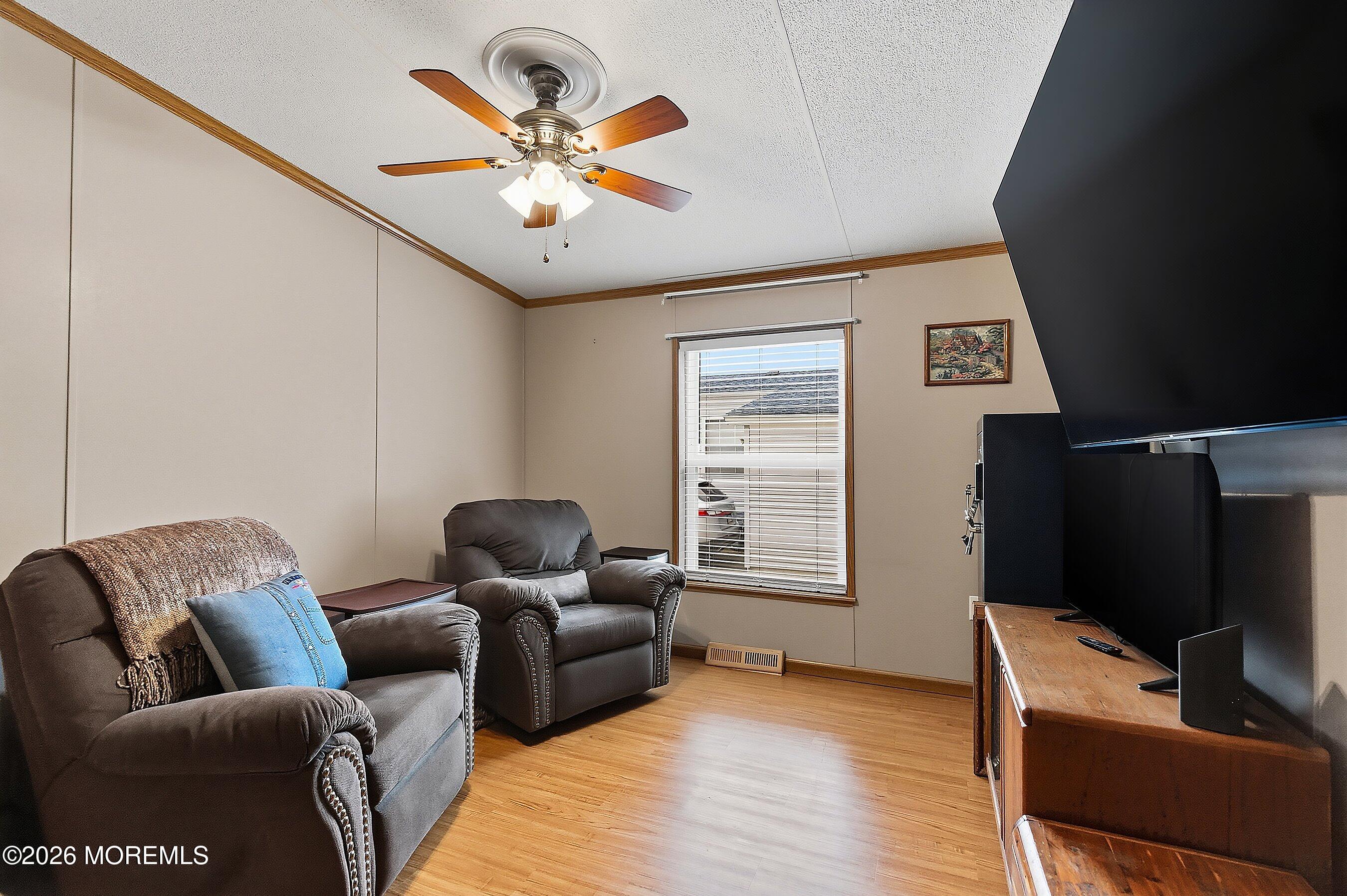 536 Momosa Way Whiting, NJ 08759 - Photo 21 of 54 a living room with furniture and a flat screen tv