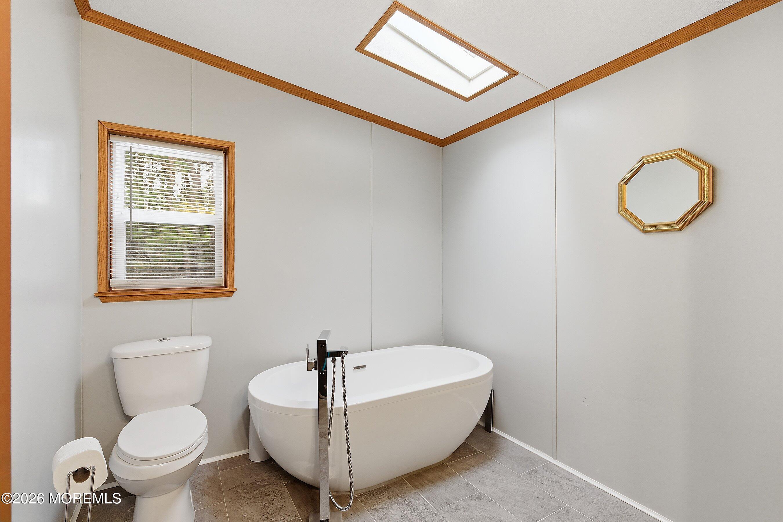 536 Momosa Way Whiting, NJ 08759 - Photo 24 of 54 a bathroom with a toilet sink and mirror