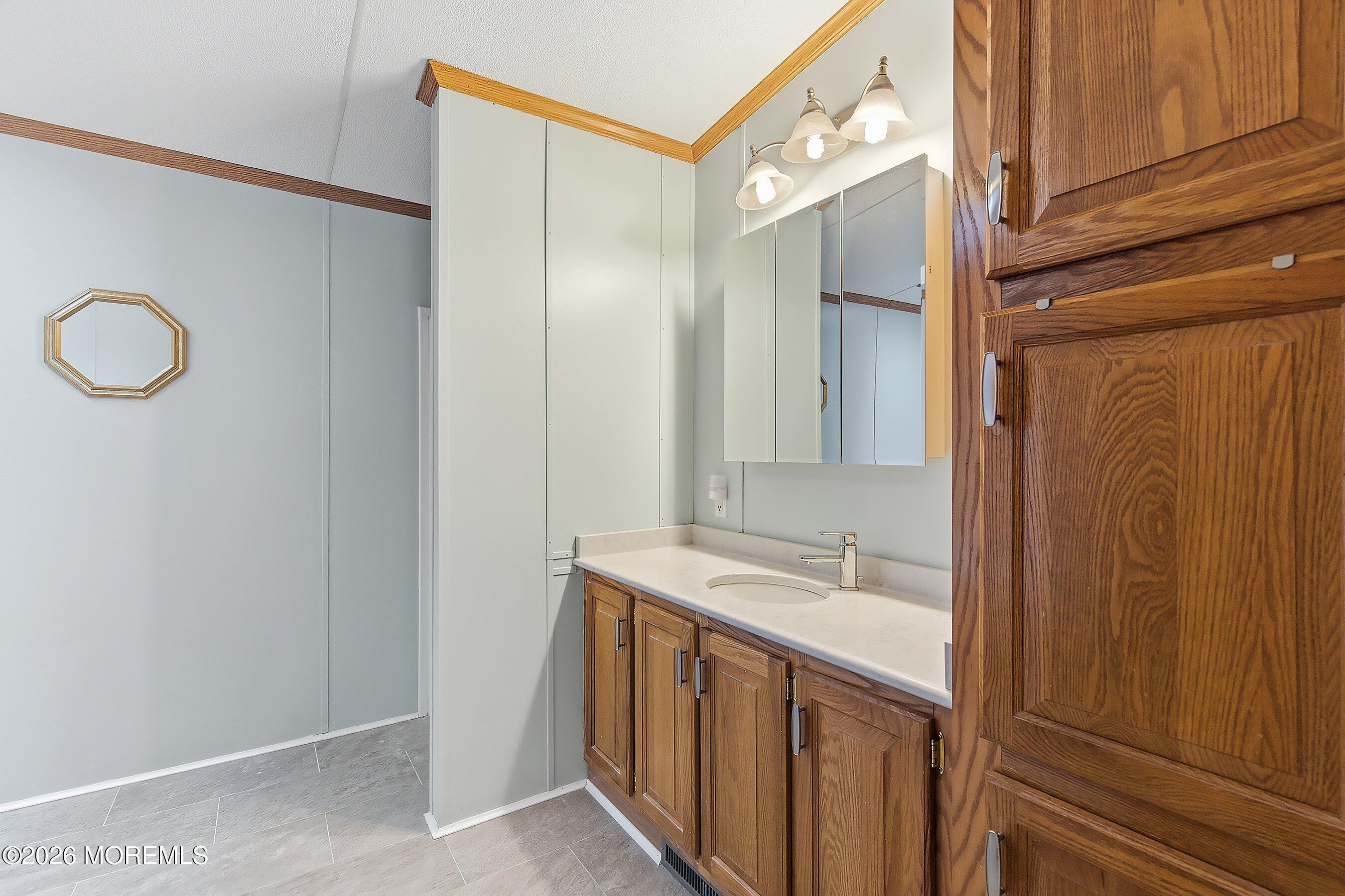 536 Momosa Way Whiting, NJ 08759 - Photo 25 of 54 a bathroom with a sink and a mirror